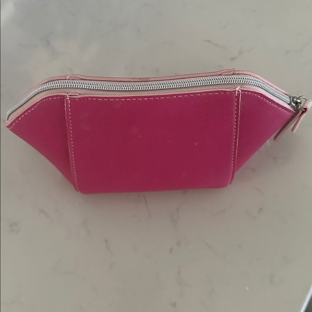 Pink Zippered Pouch with makeup samples